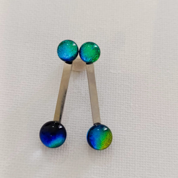 Handblown glass earrings with iridescent green and blue reflections