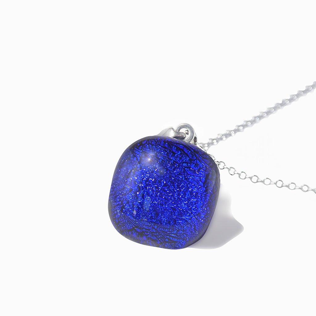 NECKLACE STARRY BLUE ~ INDIGO | SQUIRCLE | REFLET[proNECKLACE STARRY BLUE ~ INDIGOduct_vendor]MicrocosmosPRODUCT INFORMATION

Exlusive Microcosmoses Glass Reflet
Bead size length: 14 mm / 0.55" |  width: 14 mm / 0.55"

Base chain: Sterling Silver 925 ~ Stainless Steel 
NECKLACE
